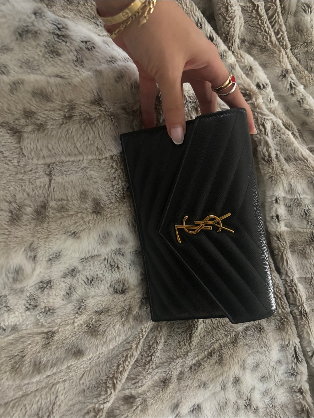 Saint Laurent black chevron quilted leather clutch with gold YSL hardware